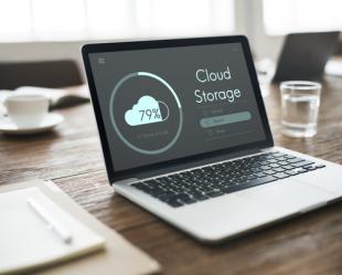 Laptop with screen reading "Cloud Storage" on it